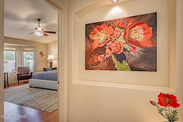 bedroom with hardwood / wood-style flooring and lofted ceiling