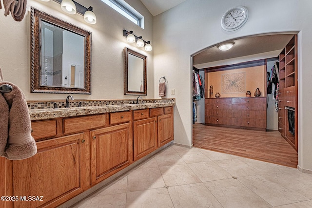 bathroom featuring tile patterned flooring and vanity