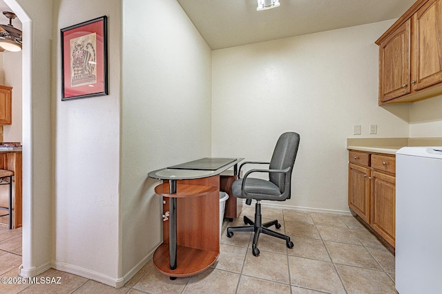 home office featuring washer / dryer and light tile patterned floors