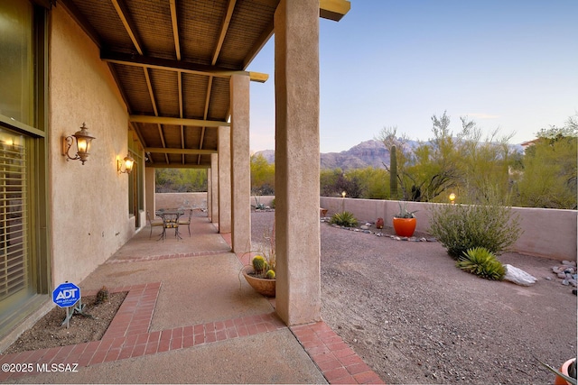 view of patio with a fenced backyard and a mountain view