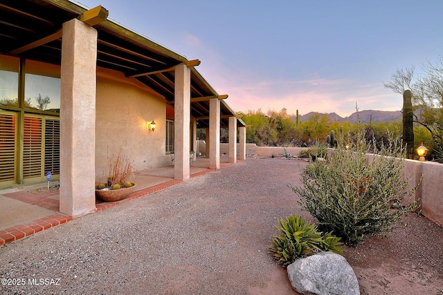 patio terrace at dusk with a mountain view