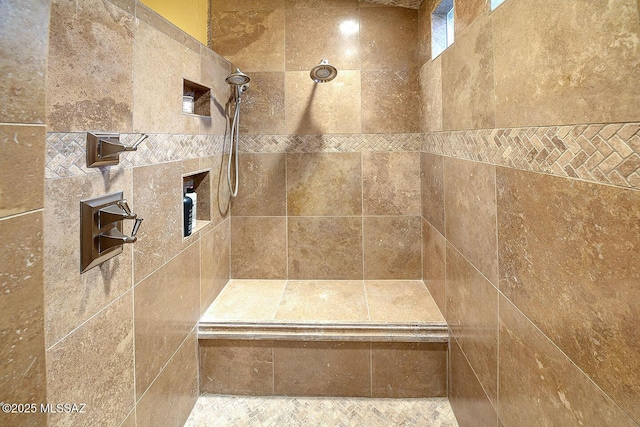 bathroom with tiled shower