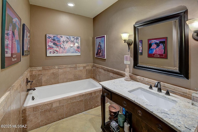 full bathroom with tile patterned floors, vanity, and a bath