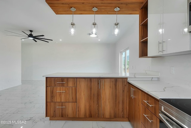 kitchen with kitchen peninsula, white cabinets, hanging light fixtures, ceiling fan, and light stone counters