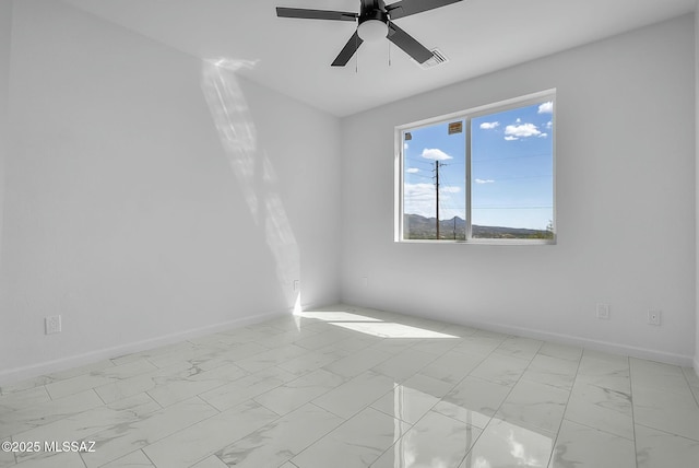 spare room with ceiling fan