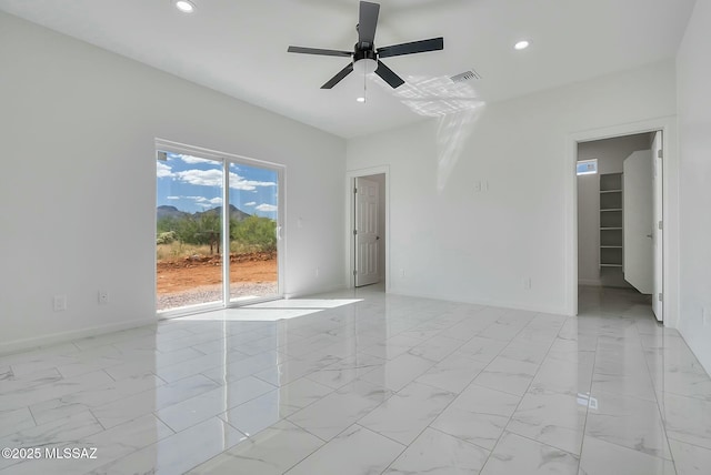 unfurnished room with ceiling fan