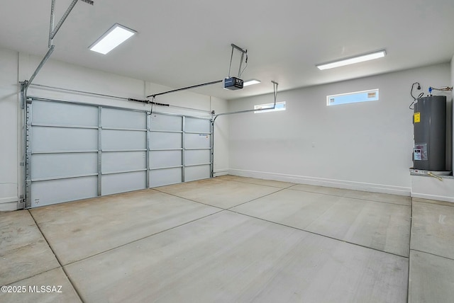 garage featuring water heater and a garage door opener