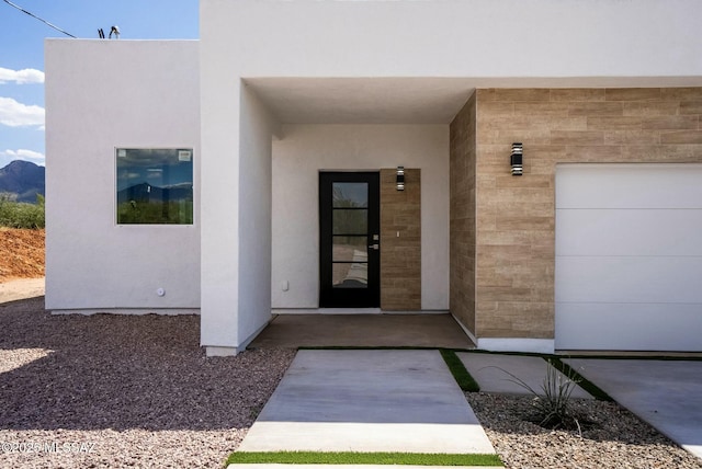 property entrance with a garage