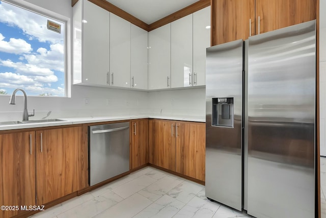 kitchen featuring white cabinetry, appliances with stainless steel finishes, and sink