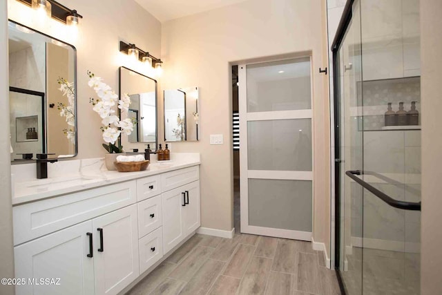 bathroom with vanity and an enclosed shower