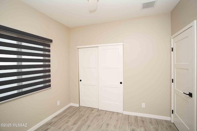 unfurnished bedroom featuring a closet