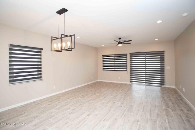 unfurnished room featuring ceiling fan and light hardwood / wood-style floors