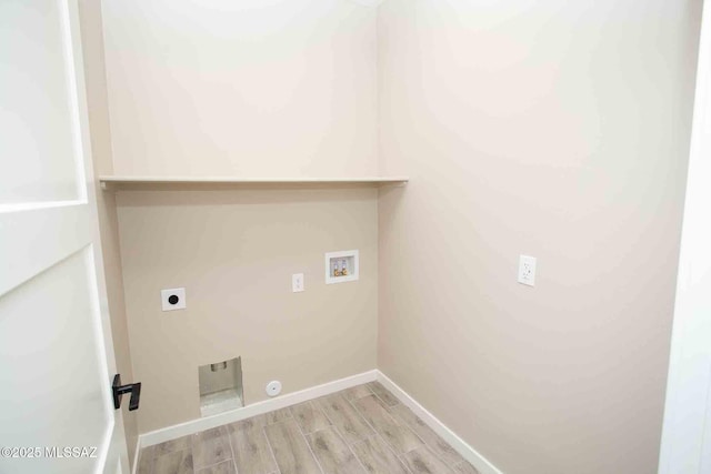 washroom featuring washer hookup, hookup for an electric dryer, and light wood-type flooring