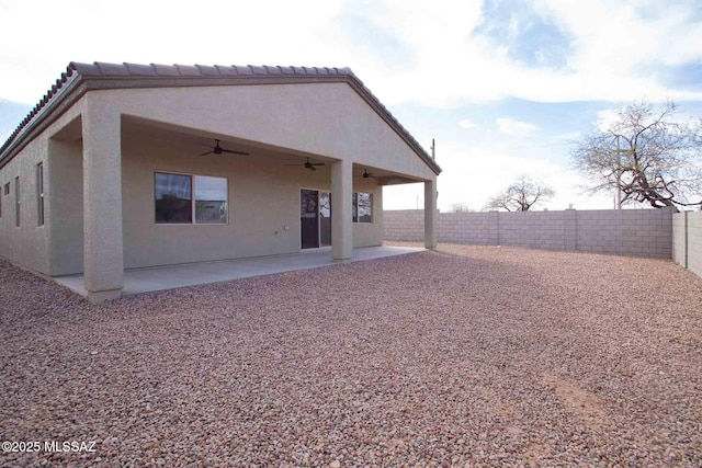 rear view of house featuring a patio area and ceiling fan