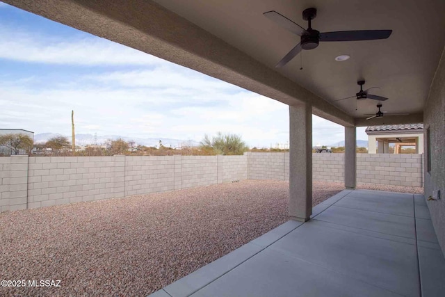 view of patio featuring ceiling fan