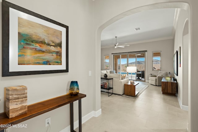 hallway featuring crown molding