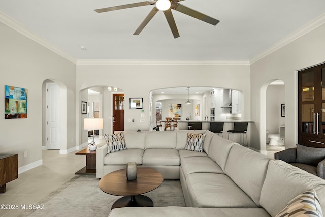 living room featuring ornamental molding and ceiling fan