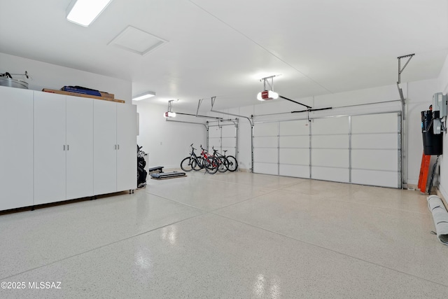 garage featuring a garage door opener