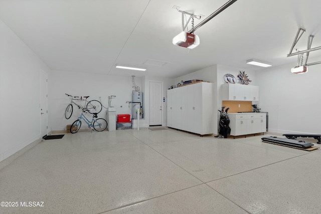 garage featuring a garage door opener and water heater