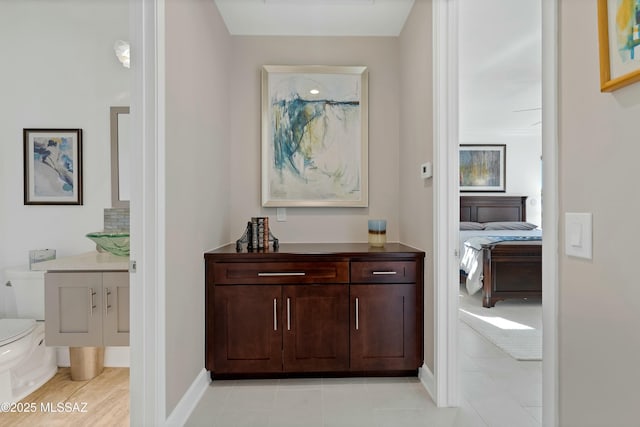 hall with light tile patterned flooring