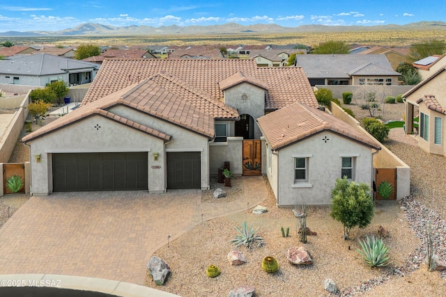 view of front of house featuring a mountain view and a garage