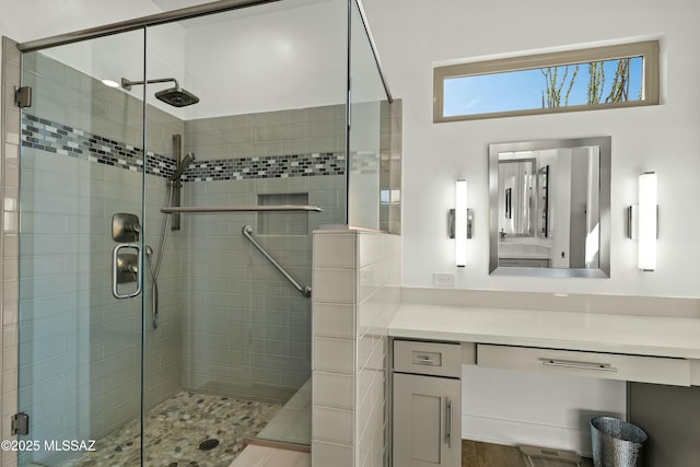 bathroom with vanity and an enclosed shower