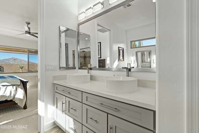 bathroom featuring vanity, plenty of natural light, tile patterned floors, and ceiling fan