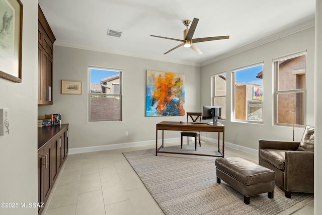 office space with ornamental molding, plenty of natural light, light tile patterned flooring, and ceiling fan