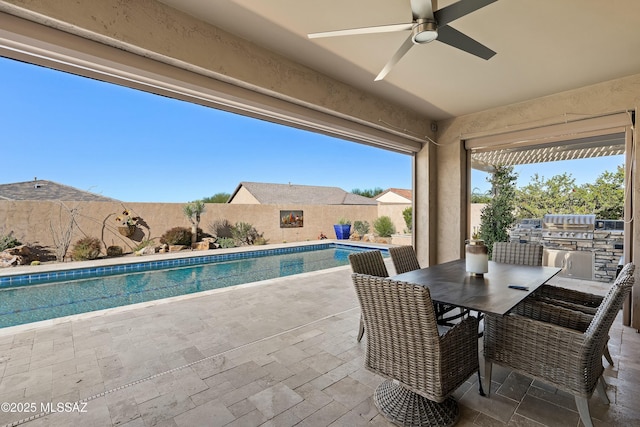 view of patio featuring a fenced in pool, area for grilling, and ceiling fan