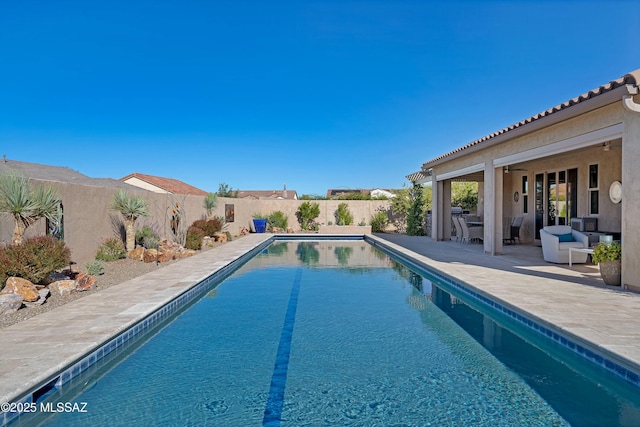 view of pool featuring a patio area