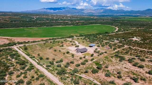 birds eye view of property featuring a mountain view