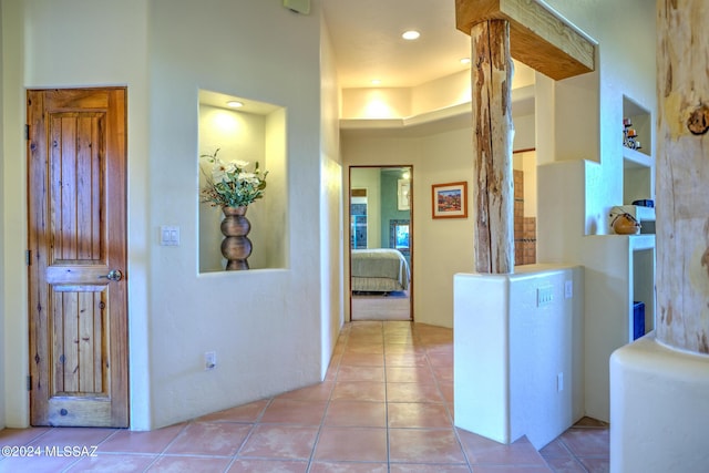 corridor with light tile patterned floors