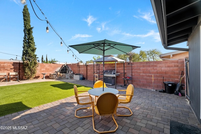 view of patio / terrace featuring a grill and a gazebo