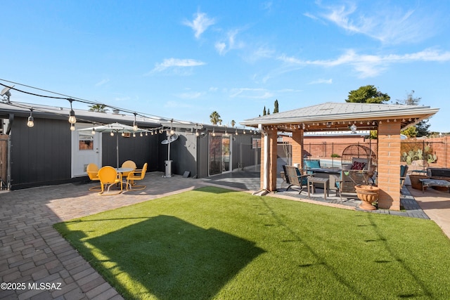 view of yard featuring a gazebo and a patio area