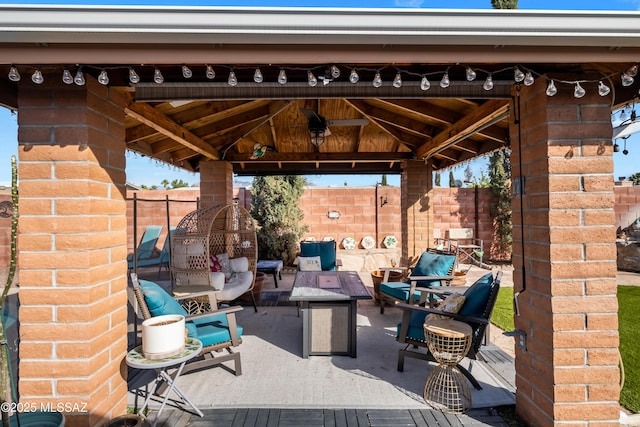 view of patio / terrace with a gazebo and an outdoor fire pit