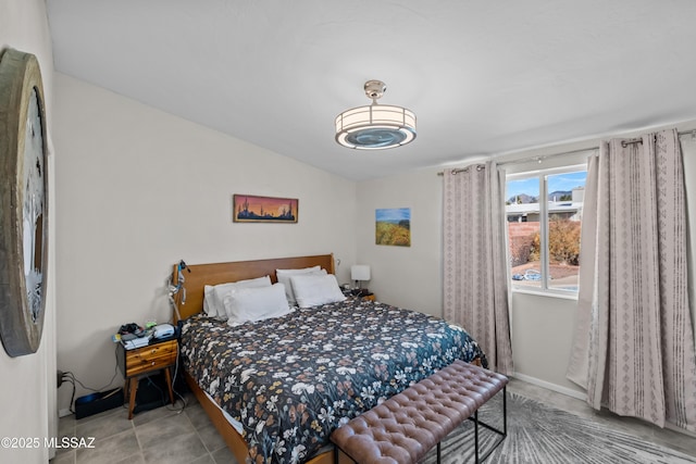 tiled bedroom with vaulted ceiling