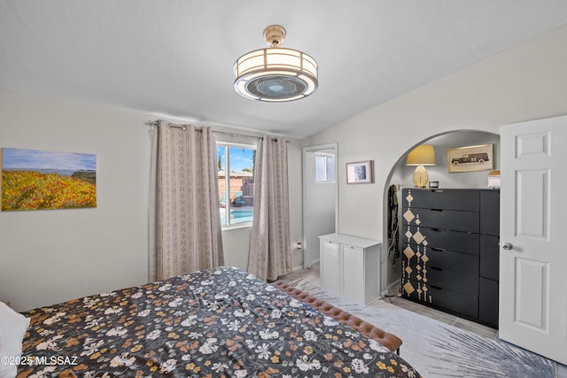 bedroom with lofted ceiling