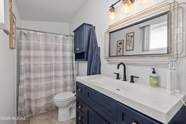 bathroom featuring vanity, decorative backsplash, tile patterned floors, and toilet