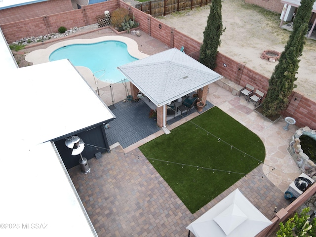 view of swimming pool with a gazebo, an outdoor bar, and a patio area