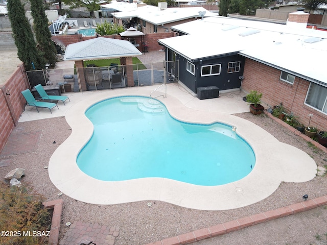 view of swimming pool featuring a gazebo and a patio area