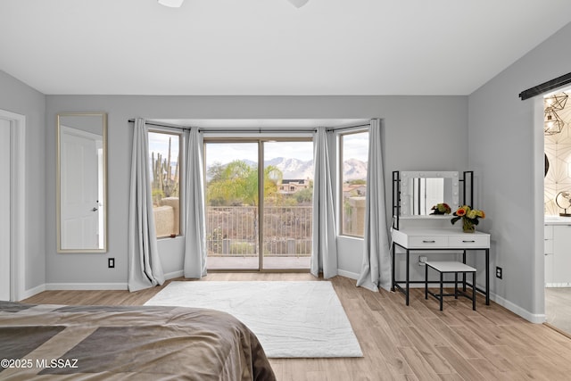 bedroom with light hardwood / wood-style flooring and access to outside