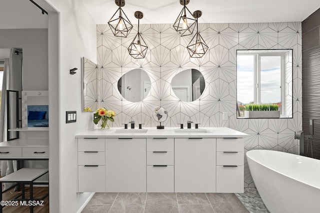 bathroom featuring a bathing tub, tile walls, vanity, and tile patterned floors