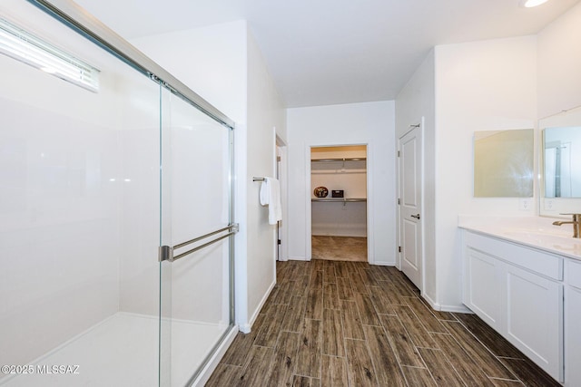 bathroom featuring vanity and walk in shower