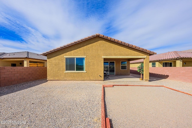 back of property with a patio area