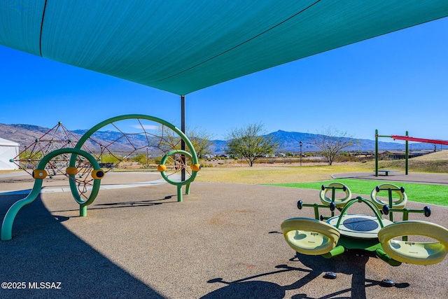 view of community with a mountain view and a playground