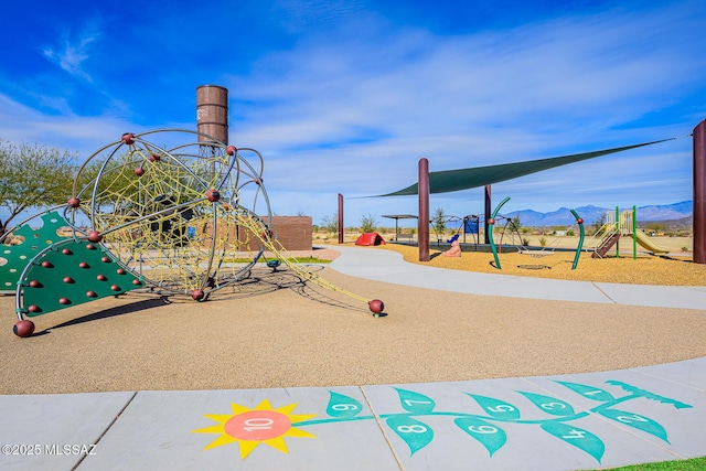 view of playground with a mountain view