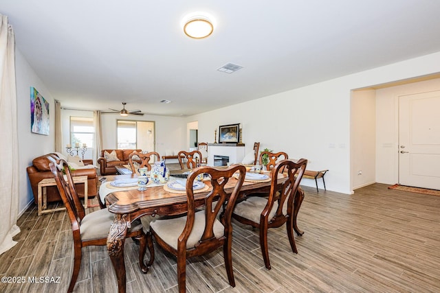 dining space featuring ceiling fan and hardwood / wood-style floors