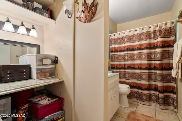 bathroom with tile patterned flooring, vanity, a shower with shower curtain, and toilet