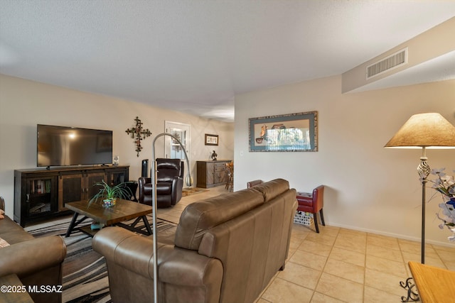 tiled living room with a textured ceiling