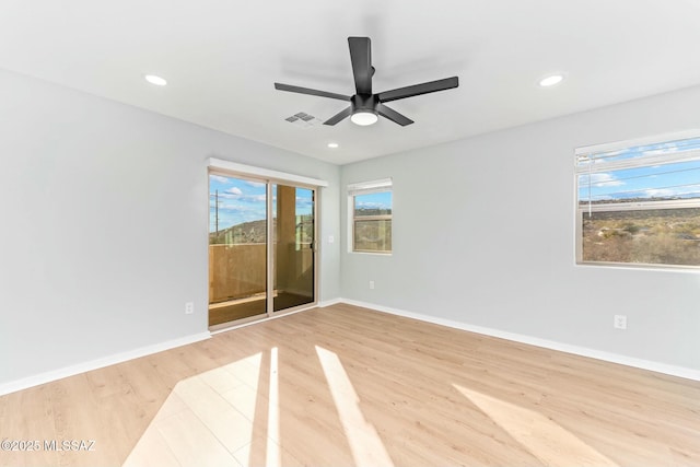 spare room with light wood-style floors, recessed lighting, visible vents, and baseboards